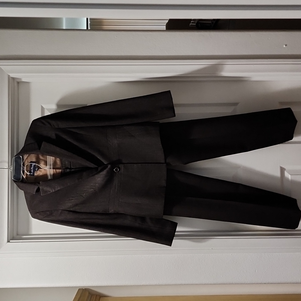 Modern brown pinstripe pant suit.  Jacket has a nice slimming trim